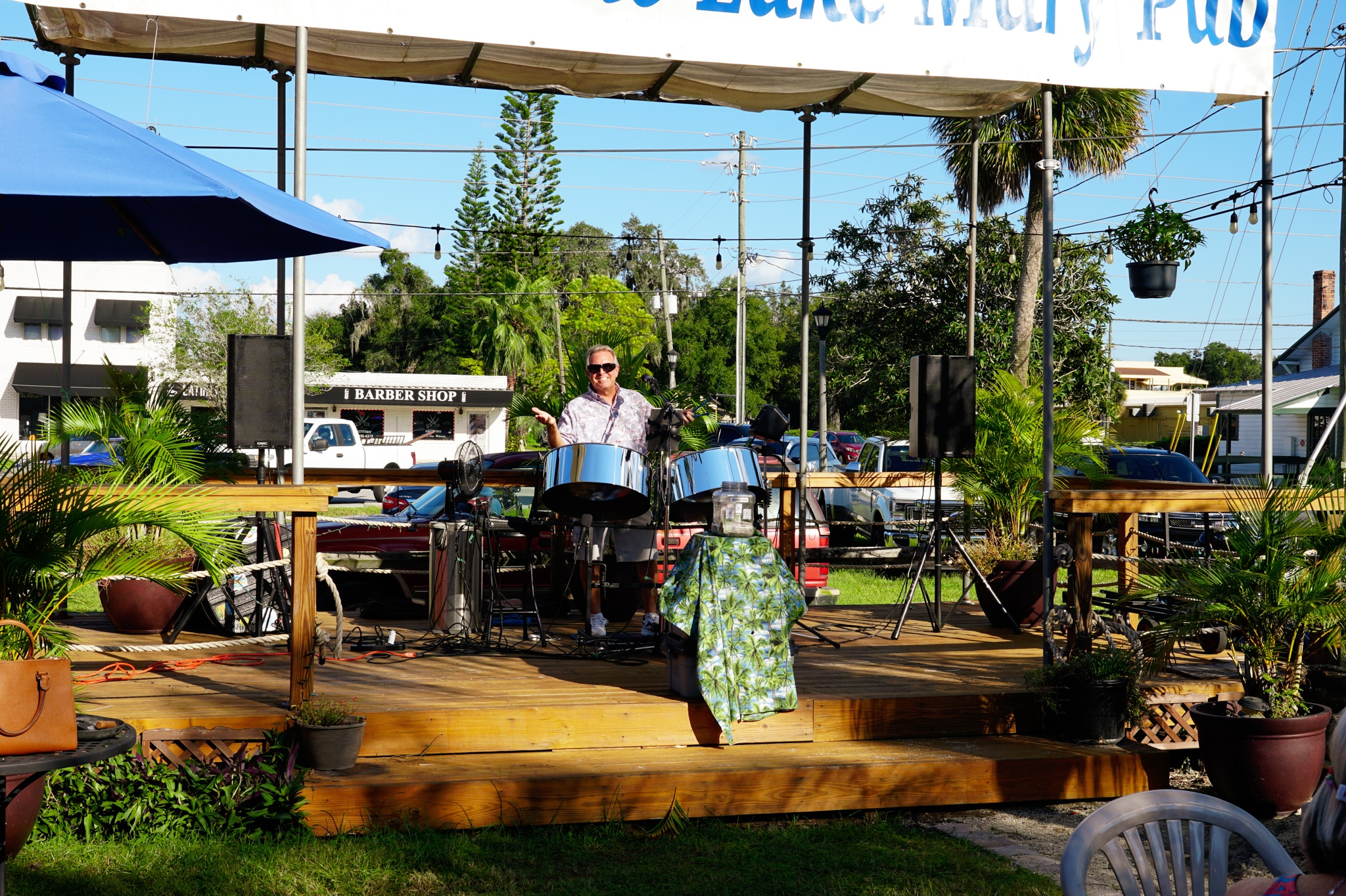 Steel-pan musician performing on the outdoor Lake Mary Pub stage