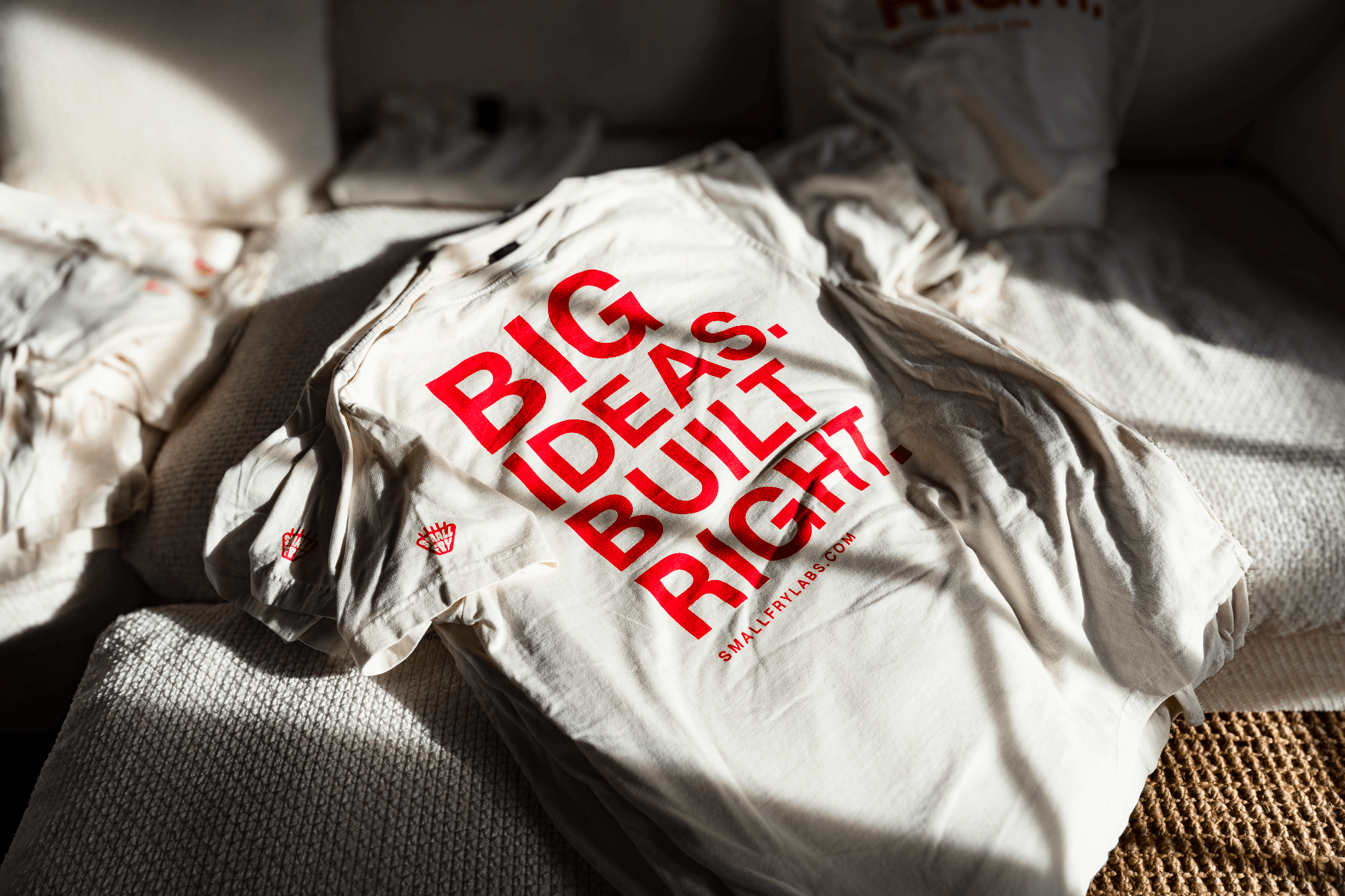 Folded Small Fry Labs shirt back in warm directional light