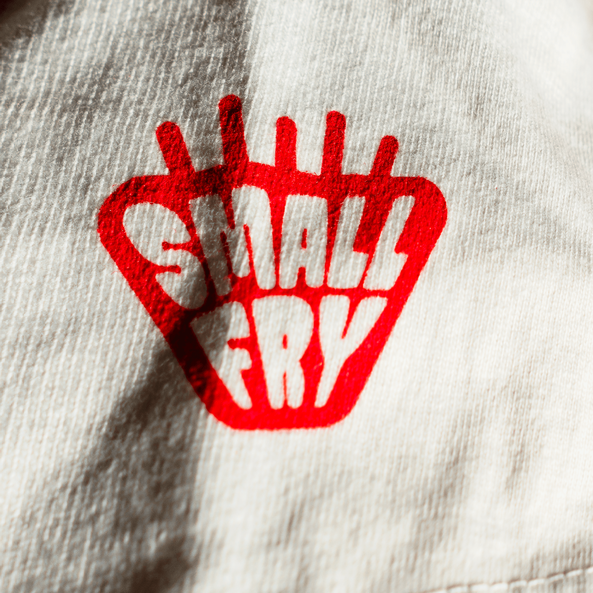 Macro of the Small Fry fry-basket sleeve mark on cotton